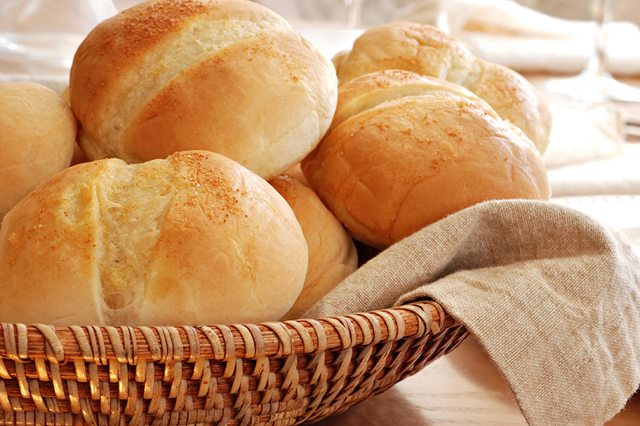 Fresh basked dinner rolls inside a basket
