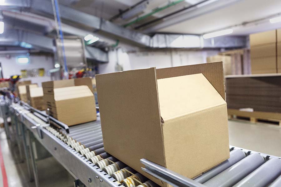 boxes-on-conveyor-900x600.jpg boxes on a conveyor belt
