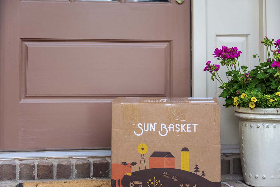 Meal kit box sitting beside front door